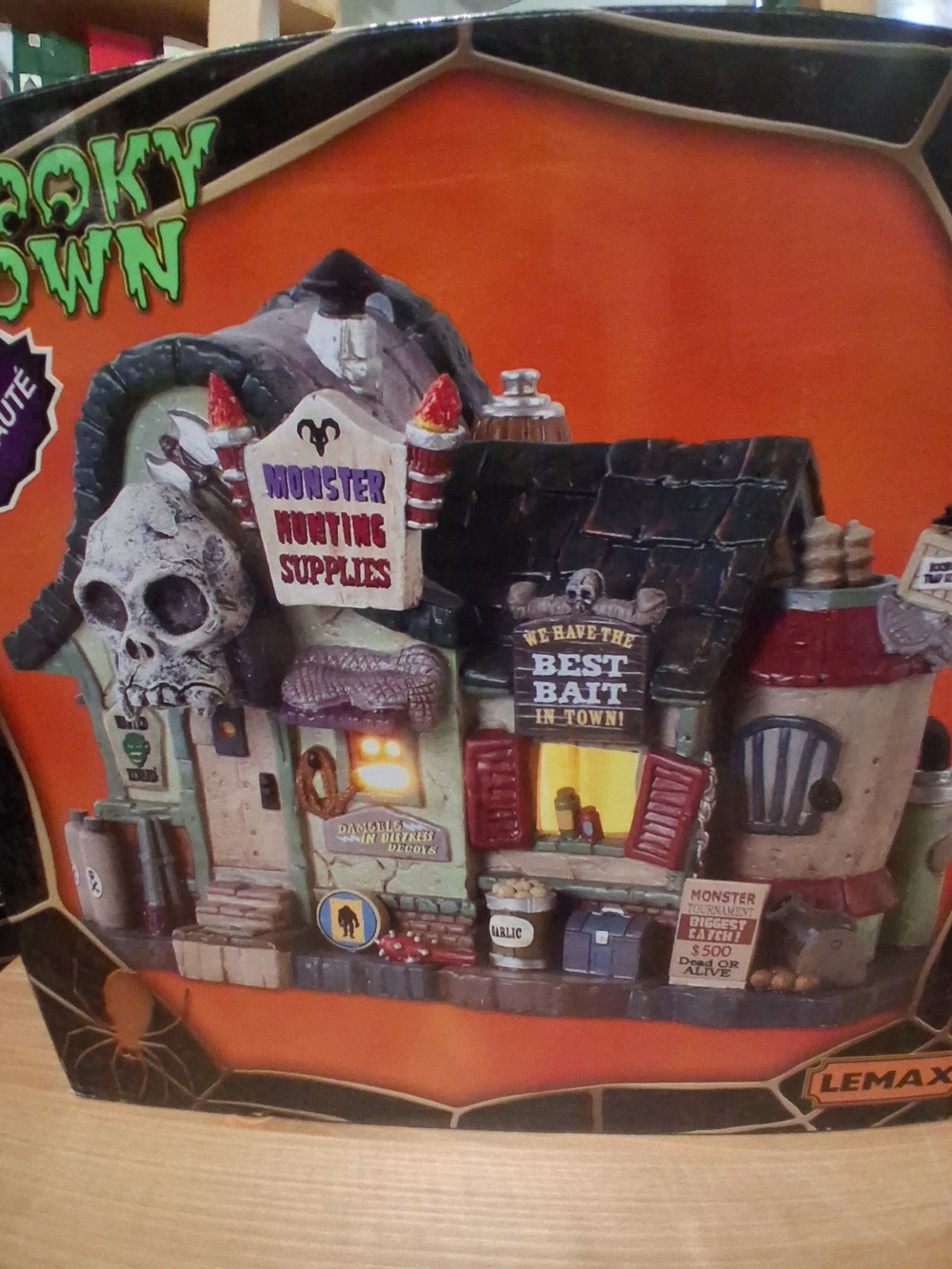 Lemax Monster Hunting Supplies Lighted Haunted Storefront - Orange, Black, Red